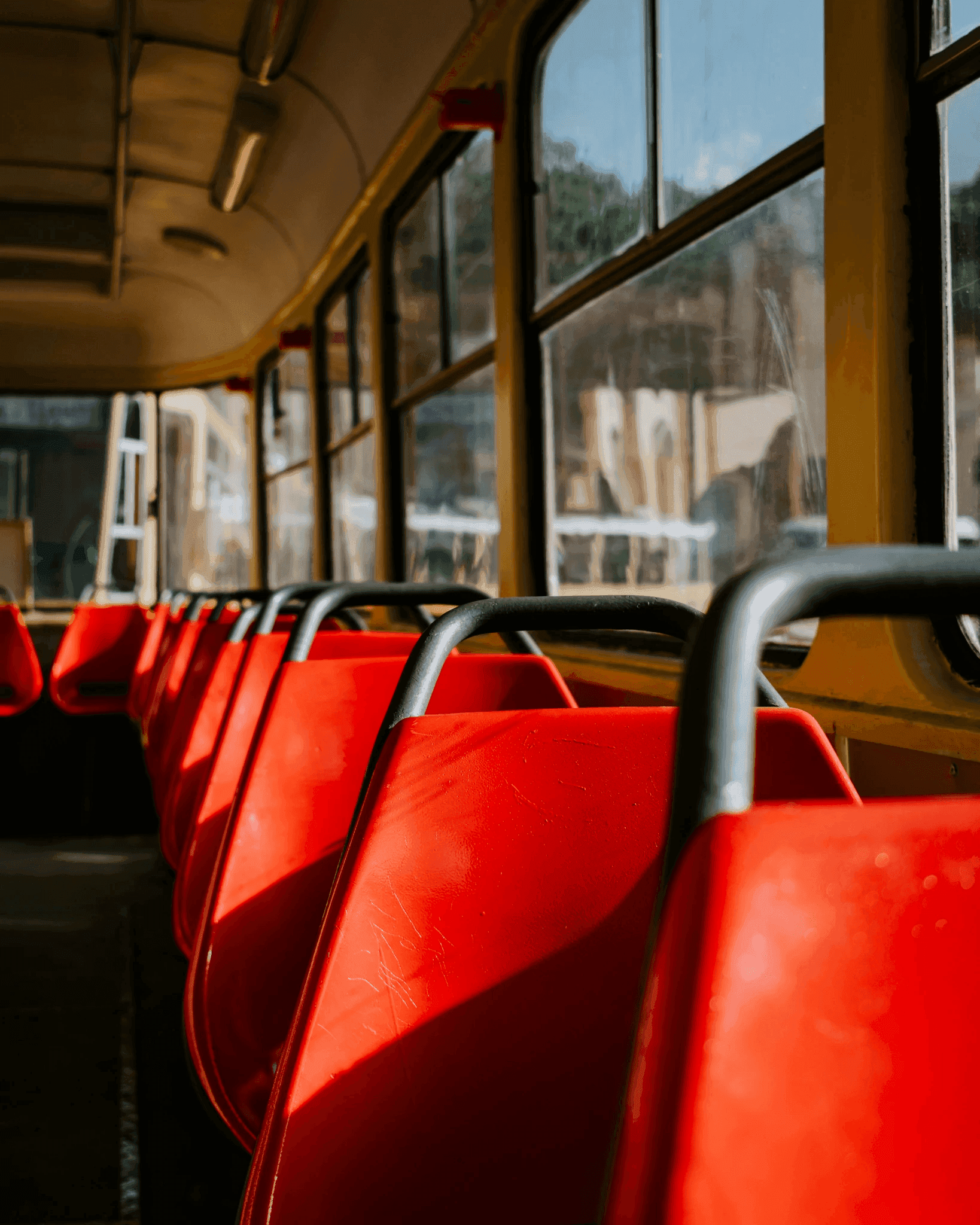 Football seats lined up in a bus.